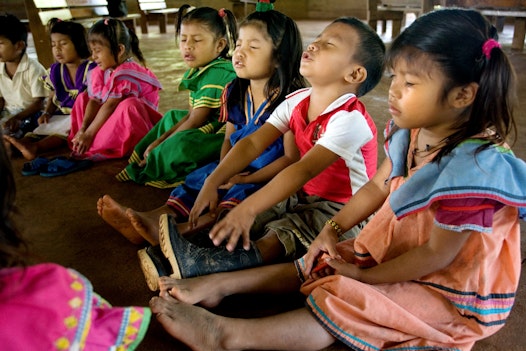 Children praying at the start of their Baha'i children's class at the Instituto Raḥmatu’lláh Muhájir in Soloy, Panama