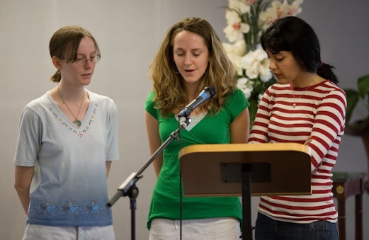 Women saying prayers before a Nineteen Day Feast at the Bahá’í Center in Austin, United States