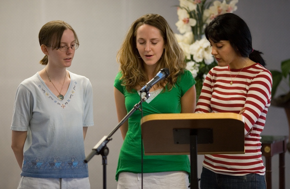 Women saying prayers before a Nineteen Day Feast at the Baha'i Center in Austin, United States