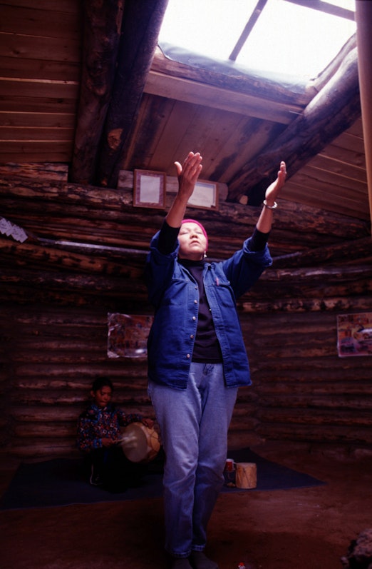 Navajo woman in prayer at a Native American Bahá’í Institute in Houck, Arizona, United States