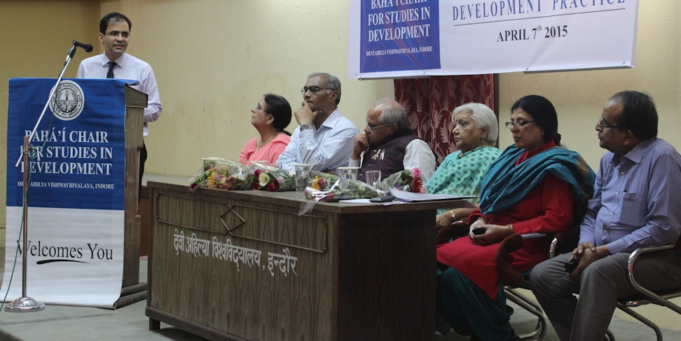 Bahá’í representative (at the podium) presents at the seminar Applying Spiritual Principles and Scientific Methods to Development Practice, organized by the Baha'i Chair for Studies in Development at Devi Ahilya University in Indore, India