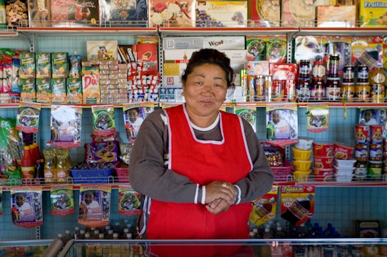 A shopkeeper in Baganuur, Mongolia who was able to expand her business because of her involvement in a community bank