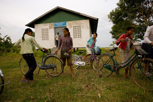 Students leaving a CORDE Center of Learning established by Cambodian Organization for Research, Development and Education, a Bahá'í-inspired organization in Battambang, Cambodia, focused on education