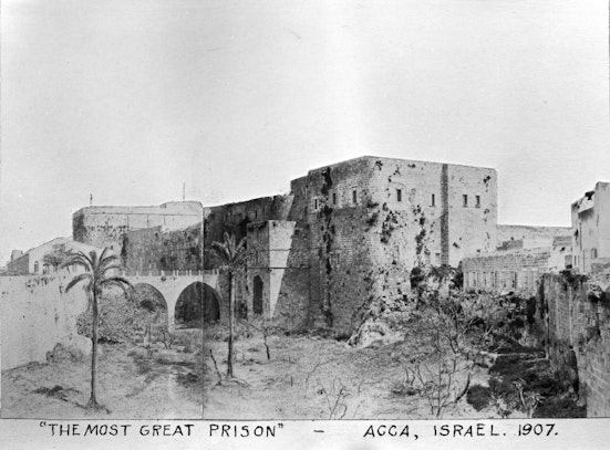 Prison of ‘Akká, where Bahá’u’lláh was incarcerated for a period of over two years -- the two windows farthest right on the second floor show the room that Bahá’u’lláh occupied in the prison, c. 1907
