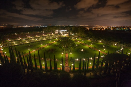 Aerial view of the Shrine of Bahá’u’lláh, the Mansion of Bahjí, and surrounding gardens at night
