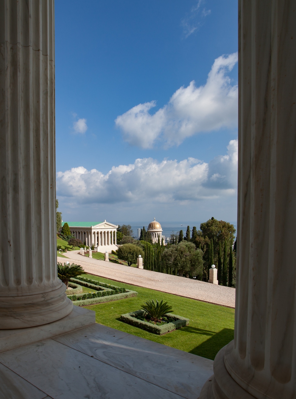 International Archives Building and the Shrine of the Báb as seen through the colonnade of the Seat of the Universal House of Justice