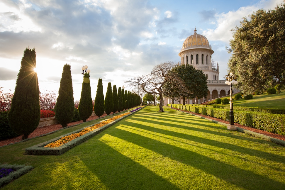 Looking at the Shrine of the Bab and its surrounding gardens at sunrise from the west