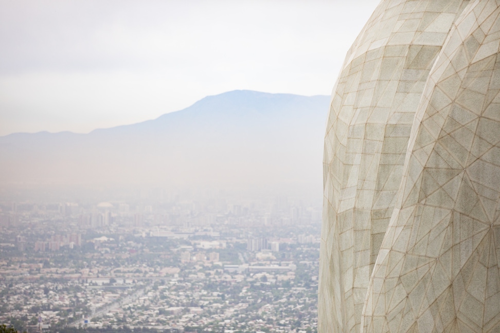 Exterior of the Continental Bahá’í House of Worship of South America (Santiago, Chile) with Santiago in the distance