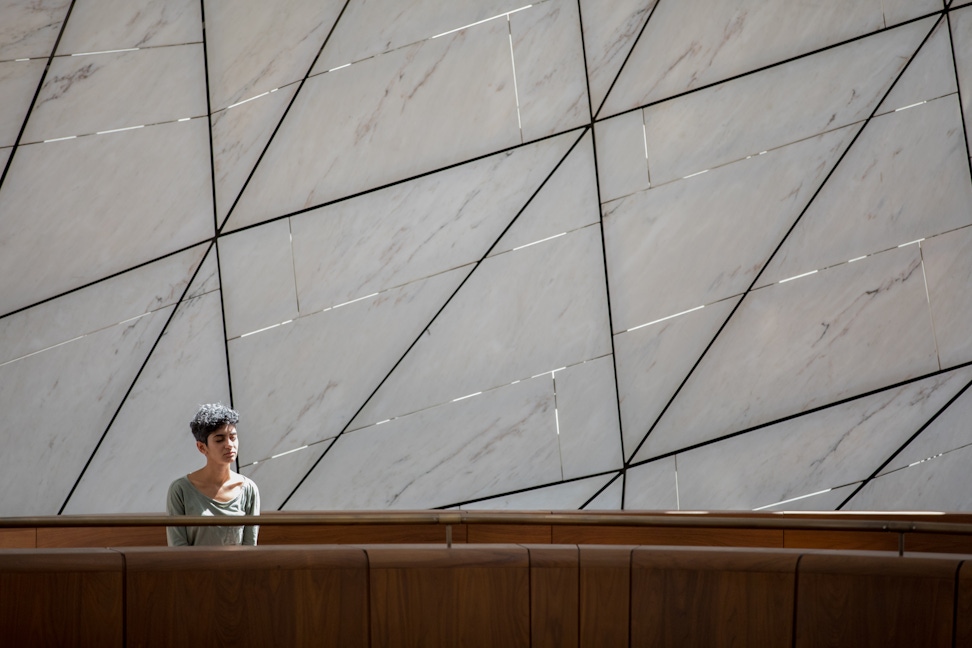 Woman seated on the upper level of the Continental Bahá’í House of Worship of South America (Santiago, Chile)