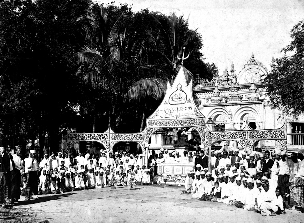 Bahá’ís of Burma with the sarcophagus they built for the sacred remains of the Báb