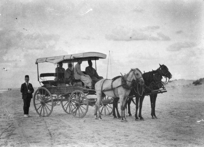 ‘Abdu’l-Bahá sitting in His carriage along the beach on His way back to Haifa from Bahjí, October 1921