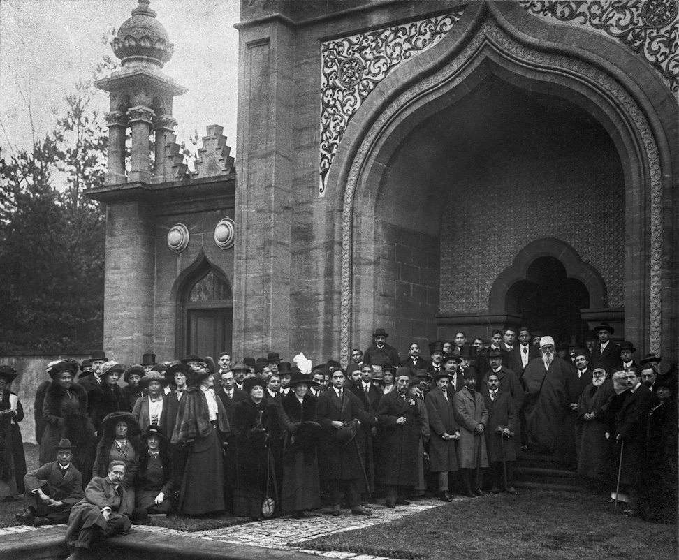 ‘Abdu’l-Bahá with a group of Egyptian, Turkish, Indian and British friends in a mosque's courtyard in Woking, England, January 1913