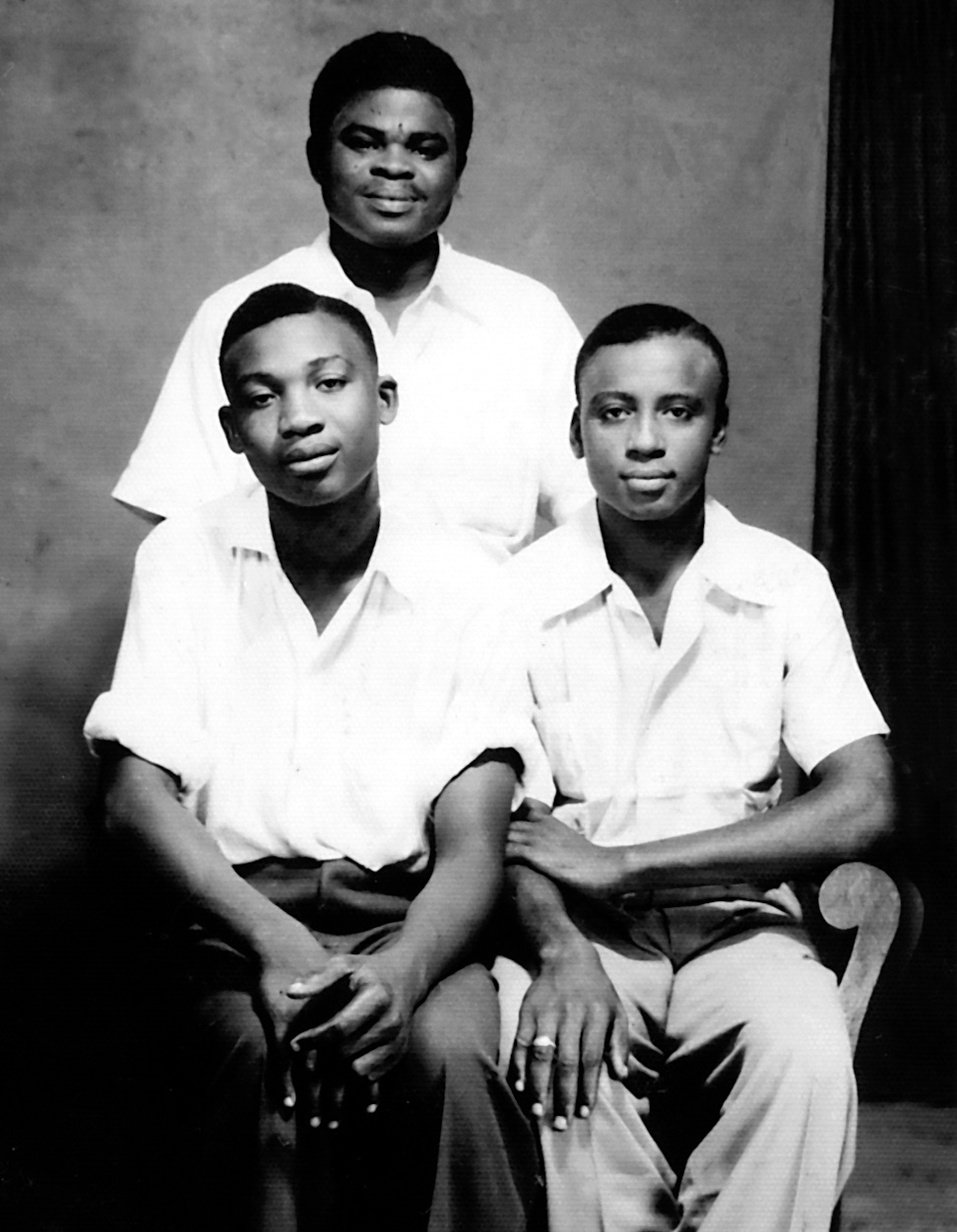 Knights of Bahá’u’lláh for French Togoland, David Tanyi (standing) and Benedict Eballa (left), with Samuel Njiki, Knight of Bahá’u’lláh for French Cameroon, 1954