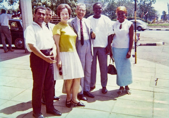 A group of Bahá’ís at the Second Intercontinental Conference, with Hands of the Cause `Alí-Akbar Furútan and Enoch Olinga, in Kampala, Uganda, October 1967