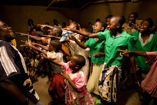 A choir preforms at a community gathering at the Baha'i centre in Mwinilunga, Malawi
