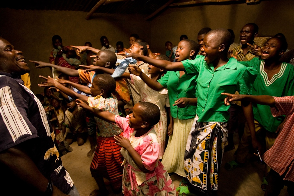 A choir preforms at a community gathering at the Baha'i centre in Mwinilunga, Malawi