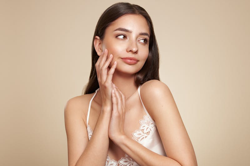 Girl touching her face