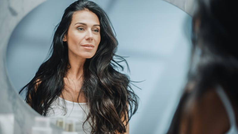 Woman looking in the mirror