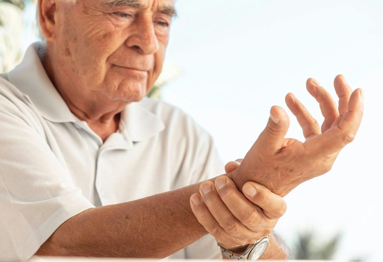 Man holding his wrist in pain