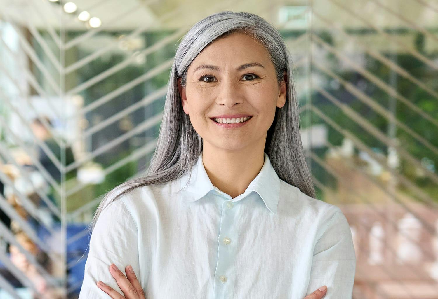 Woman in a white shirt, smiling