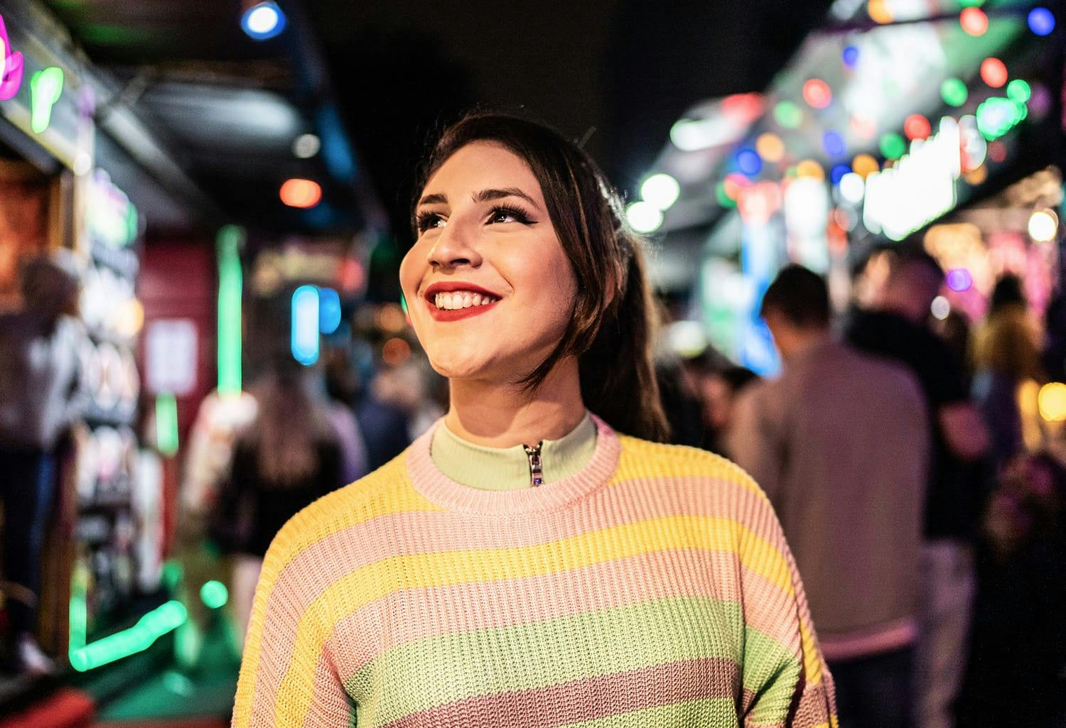 Woman in striped sweater, smiling