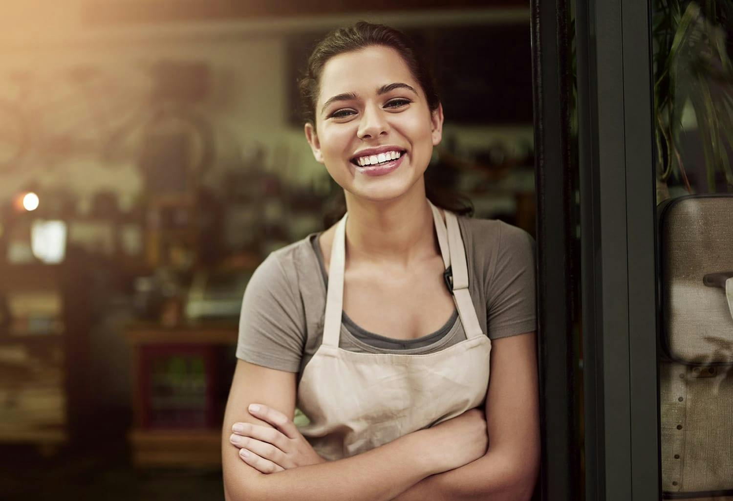 Woman in an apron, smiling