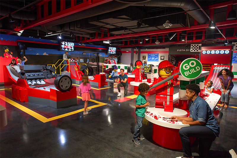 Ferrari Build and Race Promo Photo of Children Building and Testing LEGO Cars with Families