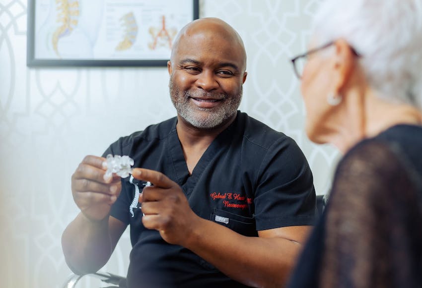 Dr. Gabriel Hunt working with an elderly patient