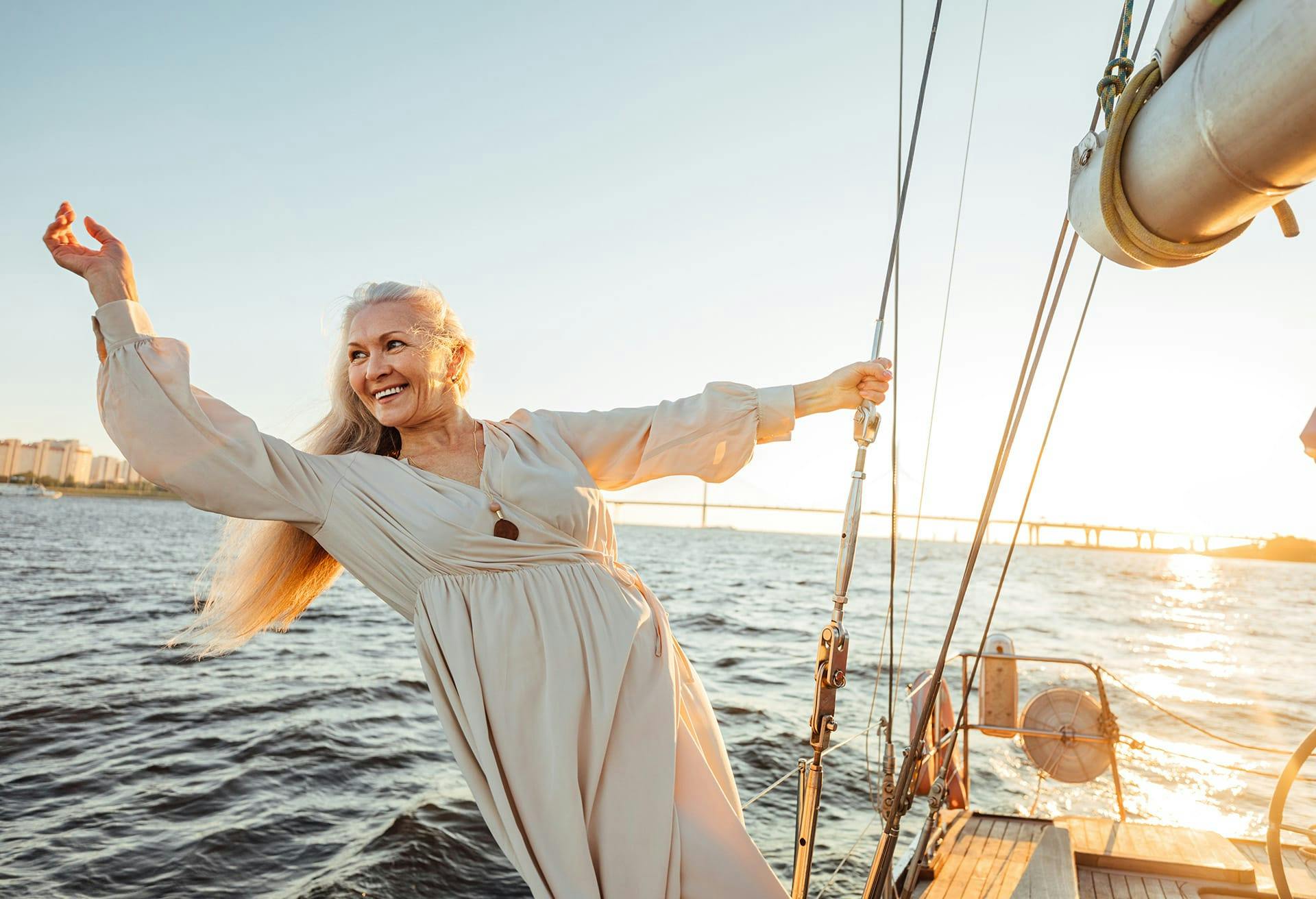 Woman holding onto a sailing rope on a boat