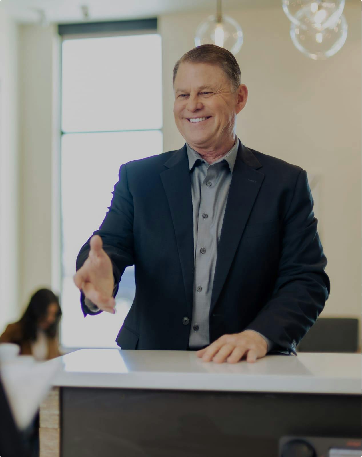 Man reaching his hand out in medical office
