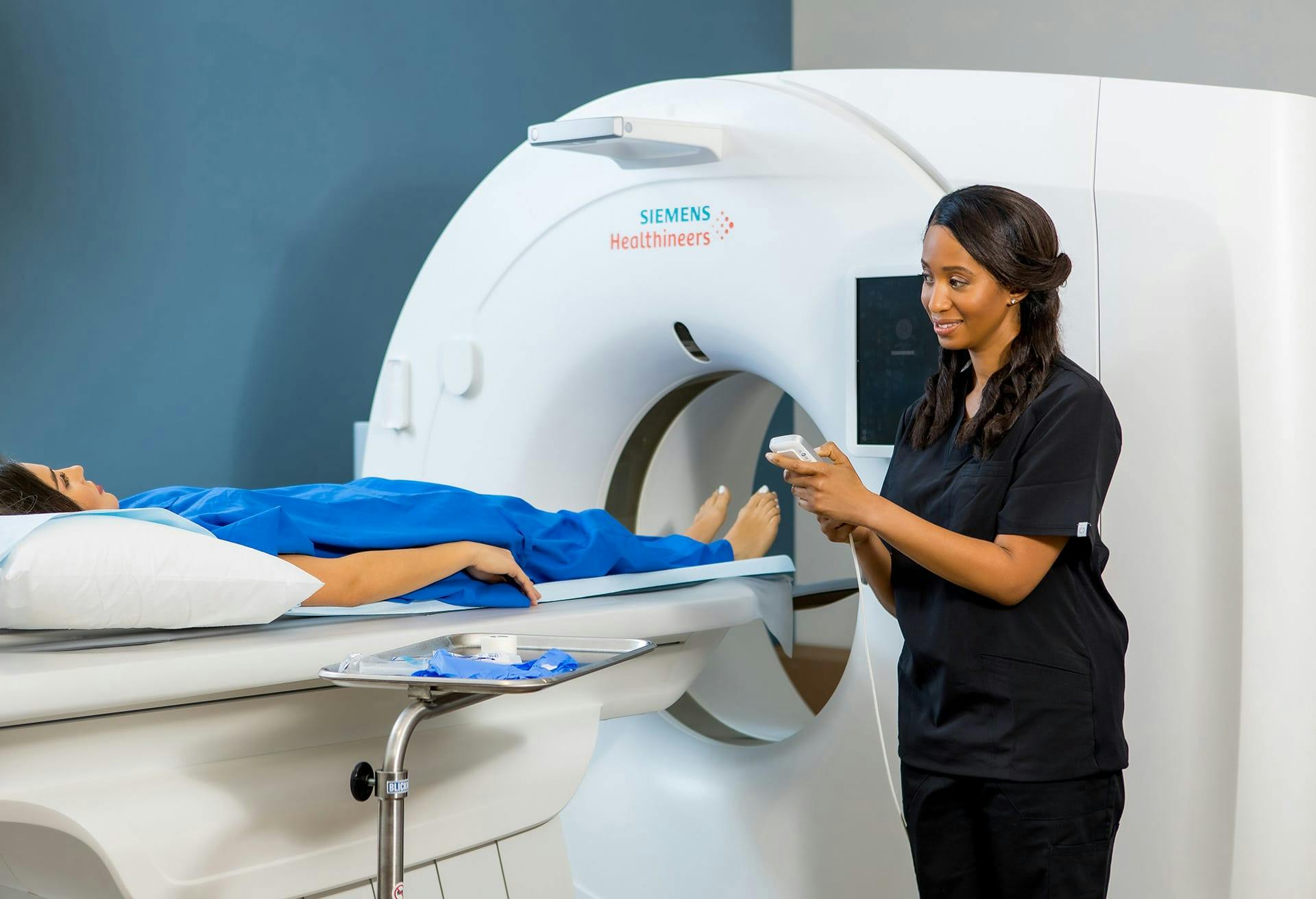 Woman performing an imaging scan
