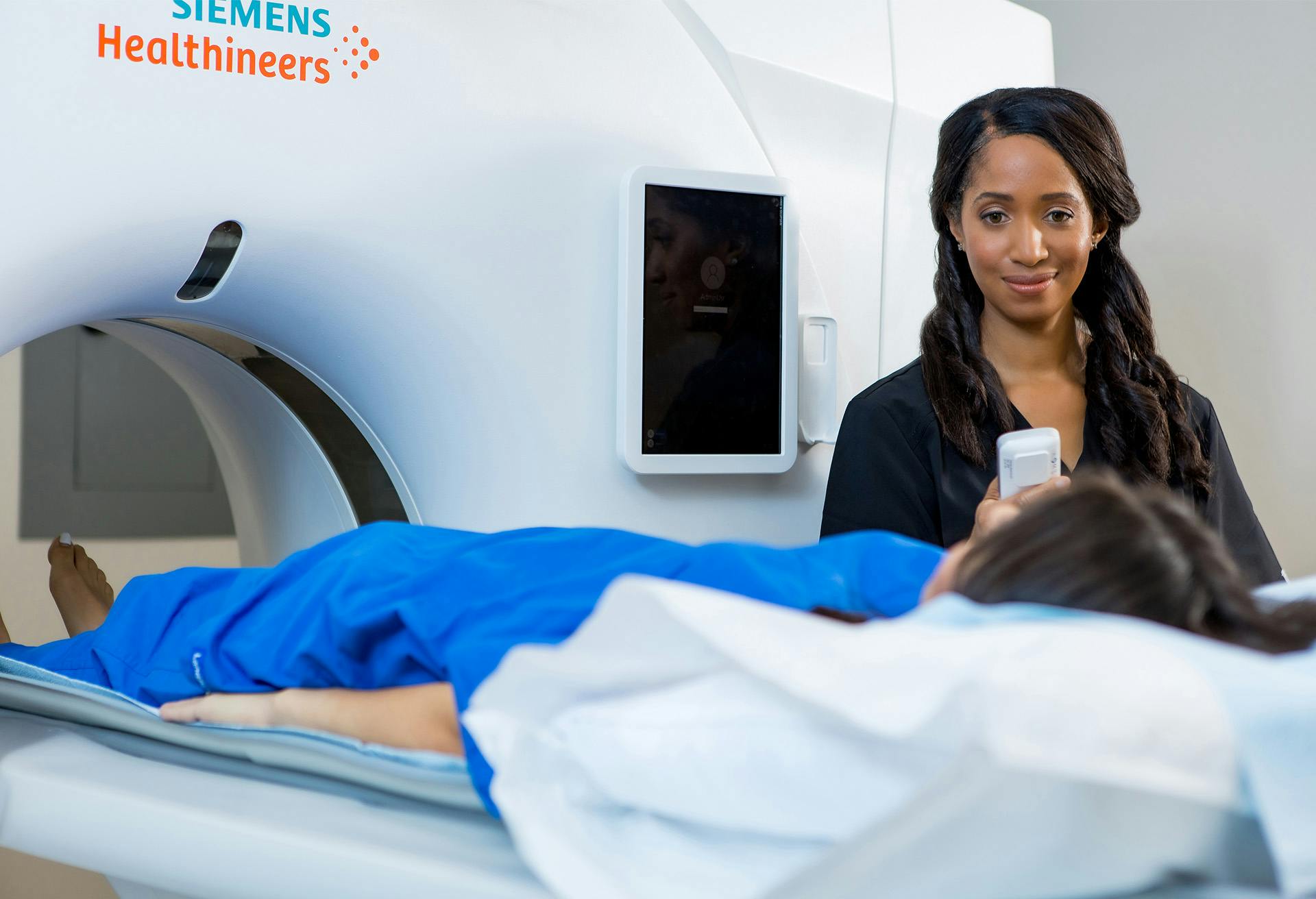 Longhorn Imaging technician performing a CT sacn on patient