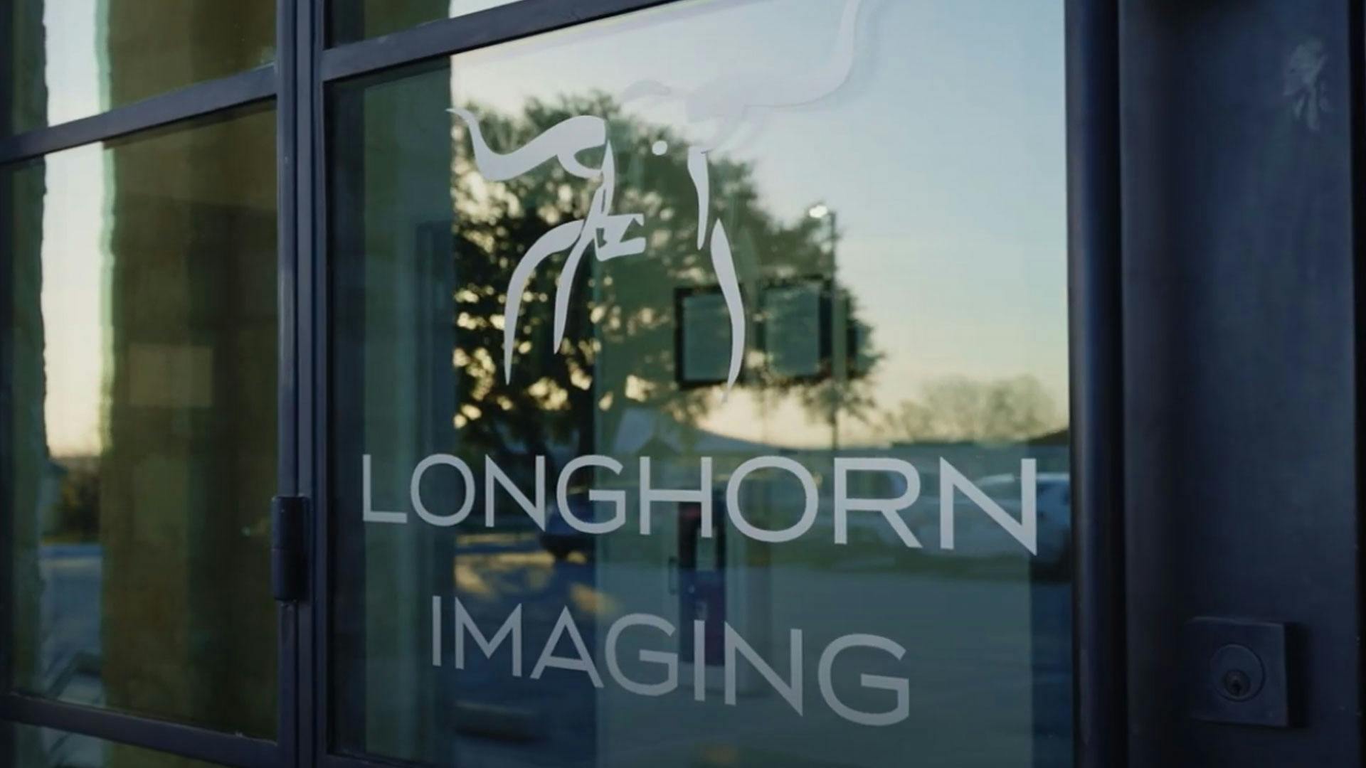 Longhorn Imaging logo on glass door