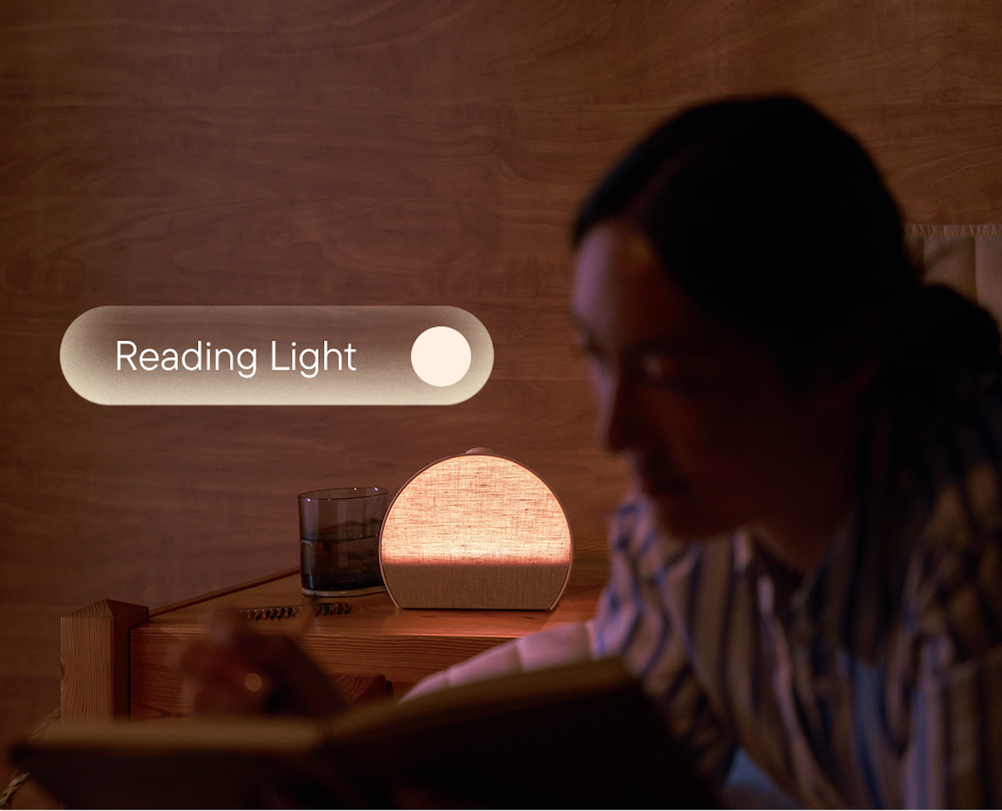 Person relaxing in a dimly lit bedroom