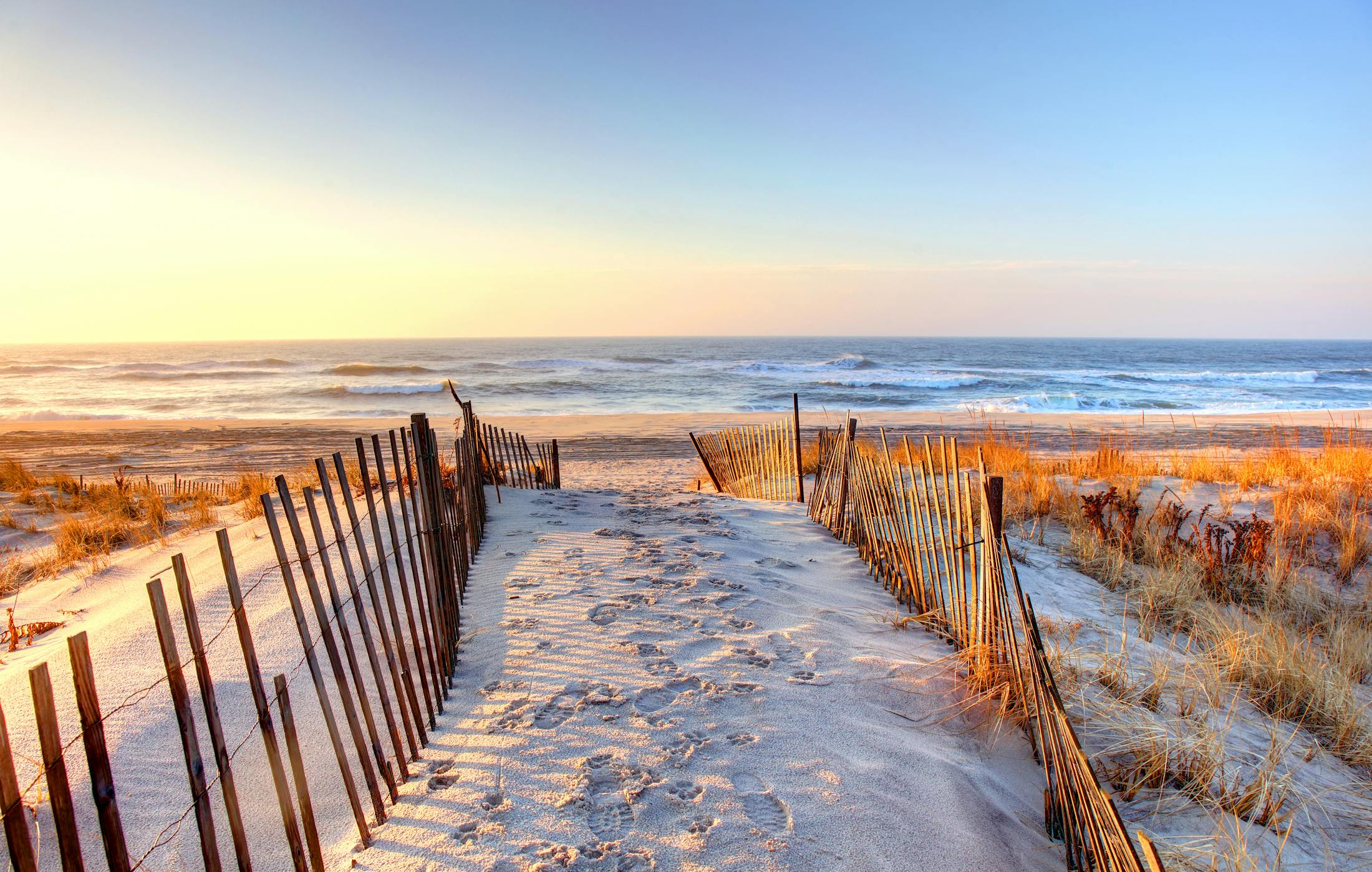 Path in the sand going down to the ocean