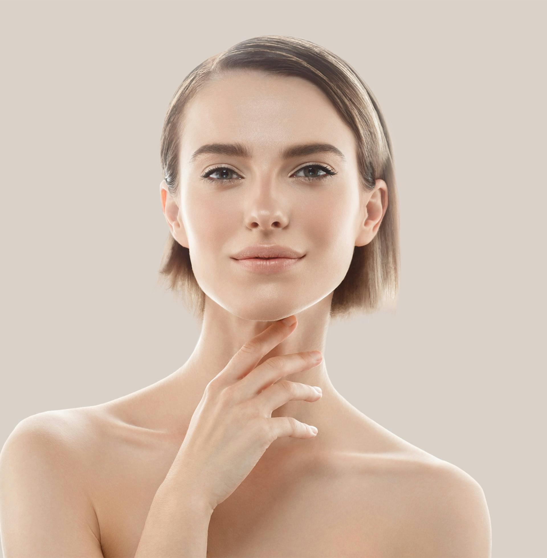 woman with her hand to her chin and no shirt posing for a picture