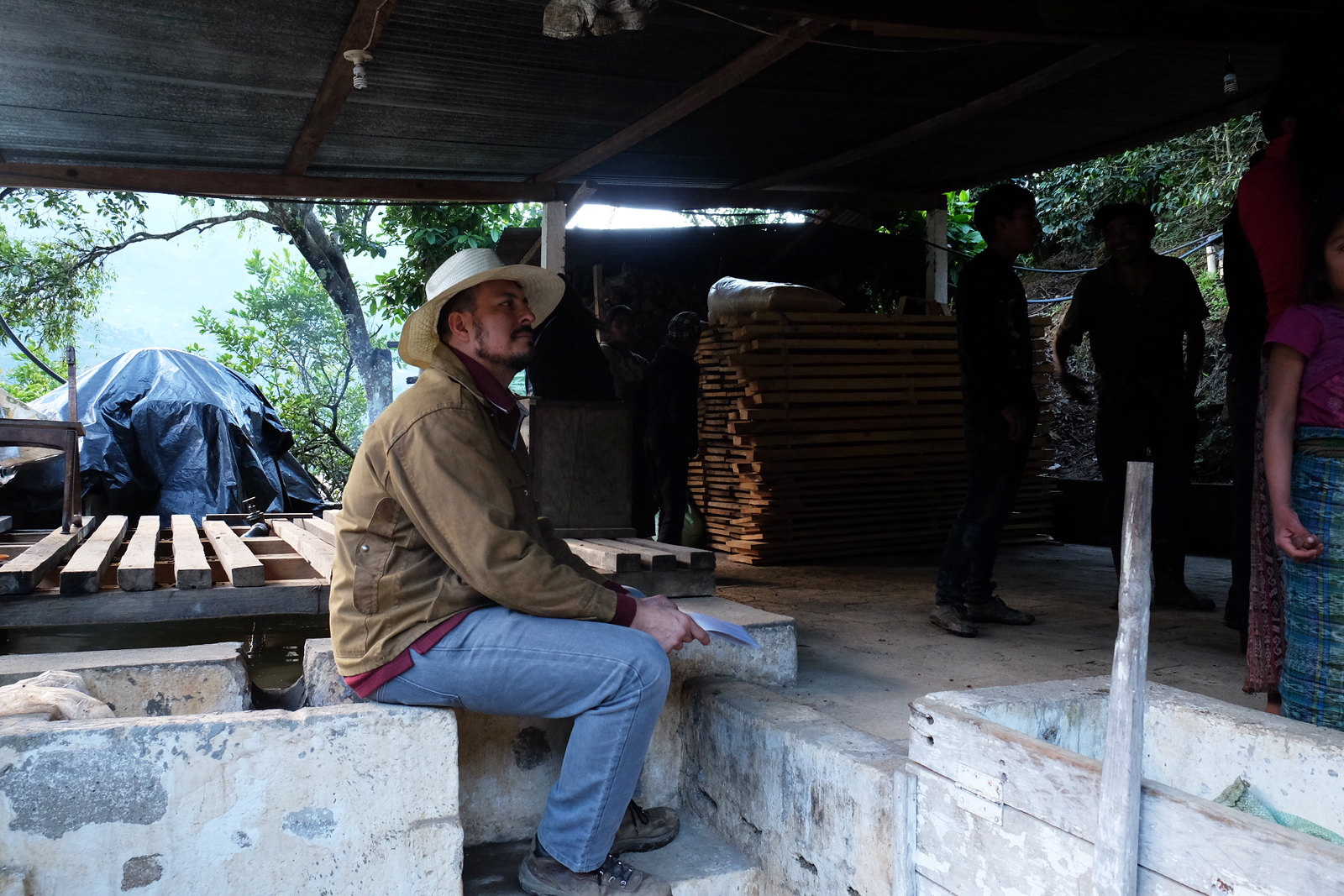 Edwin Martinez talking with pickers about picking only the ripest cherry