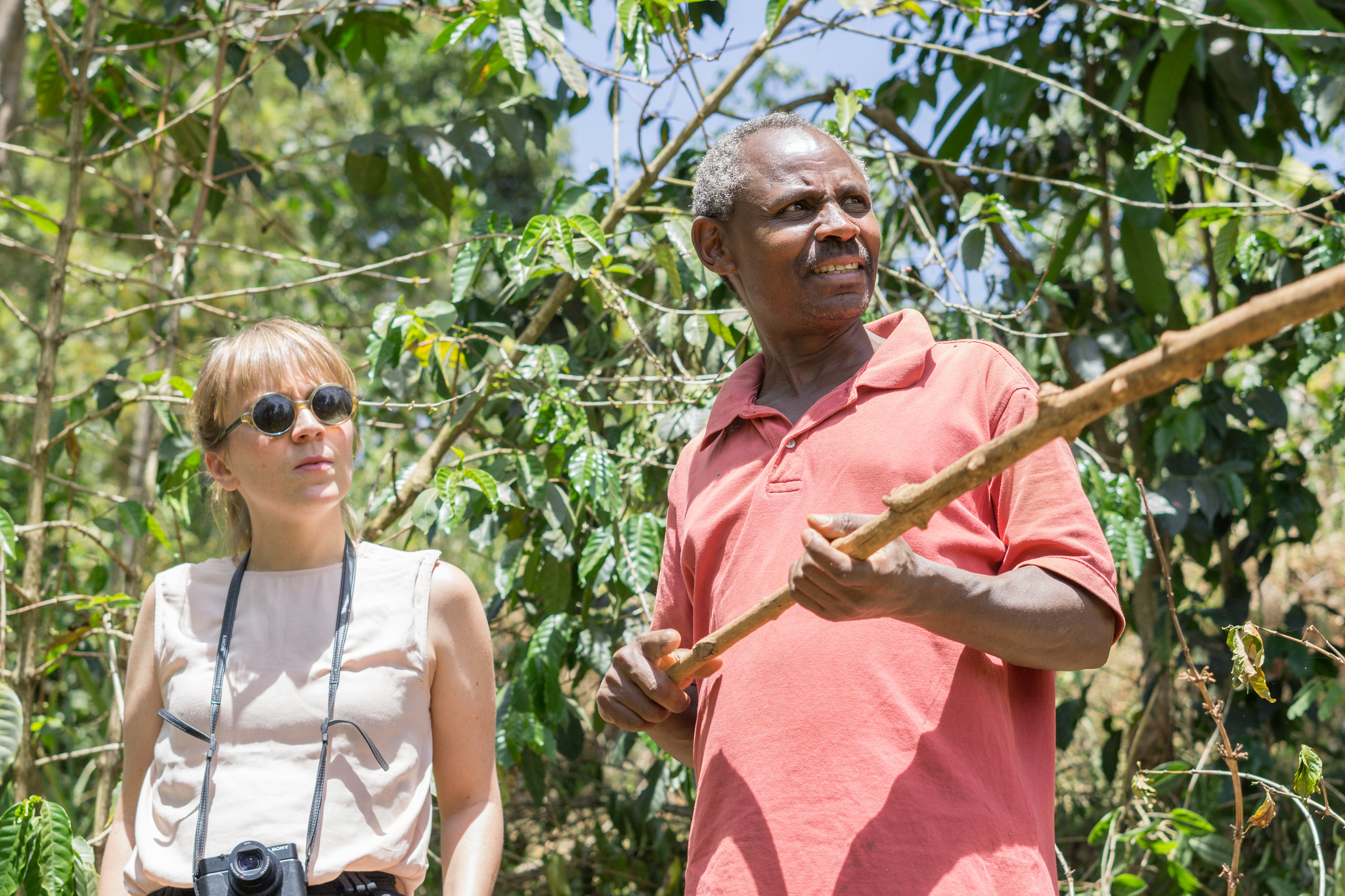 Kieni farmer Stephen Githinji showing Astrid his coffee trees
