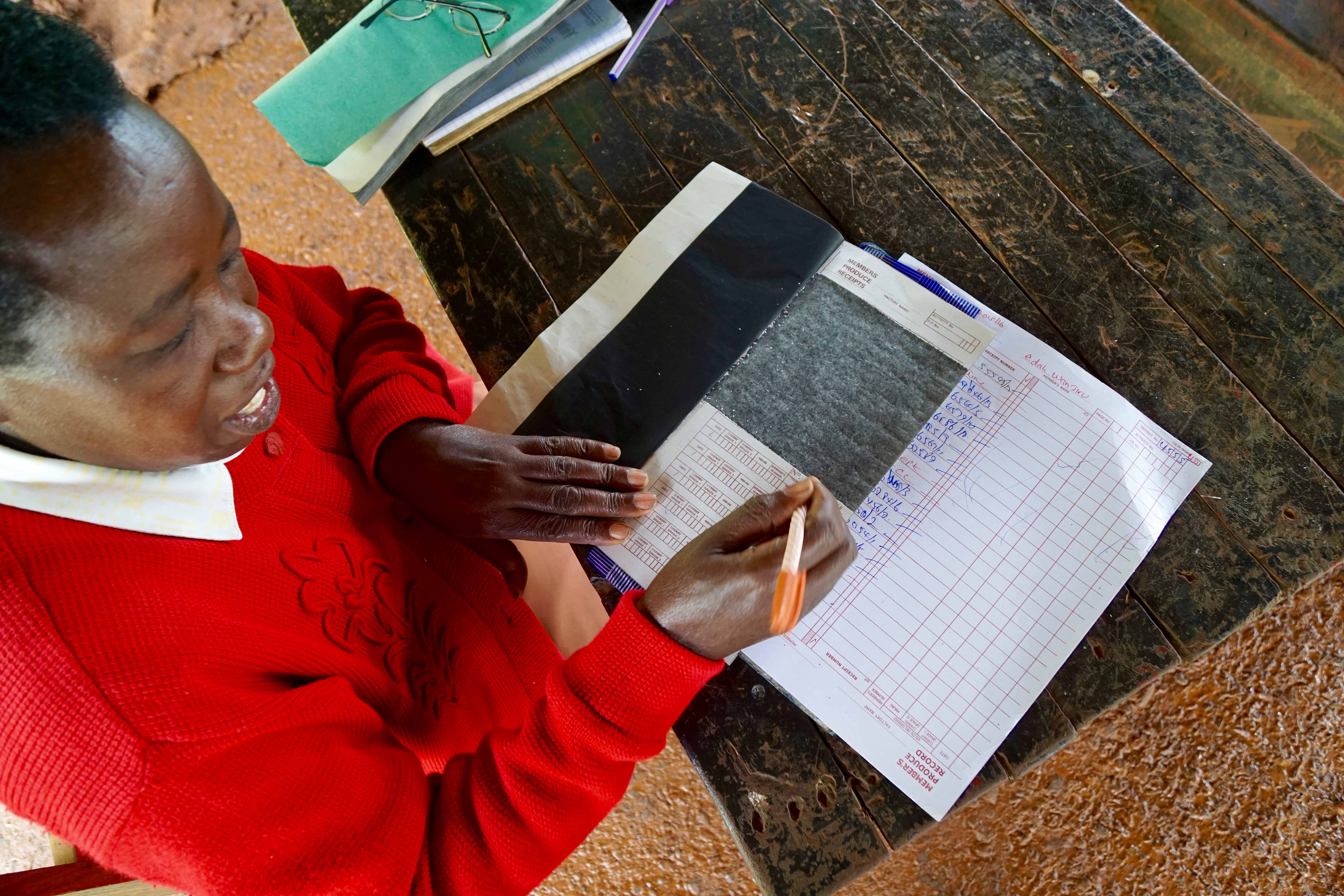 Receipt = money. Each farmer gets a receipt for the kilos of cherries they've delivered each picking day. Payment is not until several months later, when the cooperative have sold all the coffee and know how much money they have to distribute to the members.