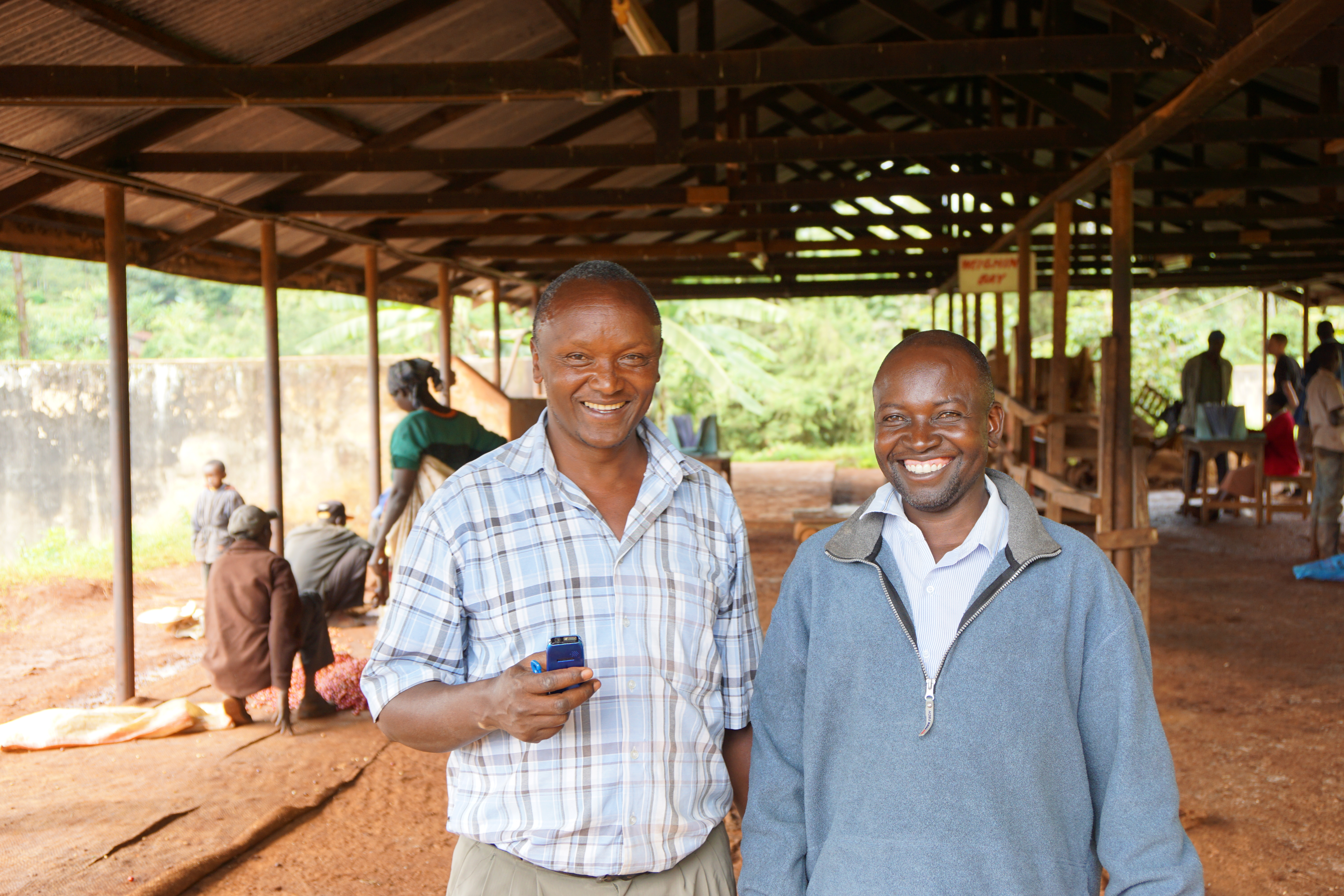 Wet mill factory manager at Kieni Josphat Kariuki and chairman Charles Murimi