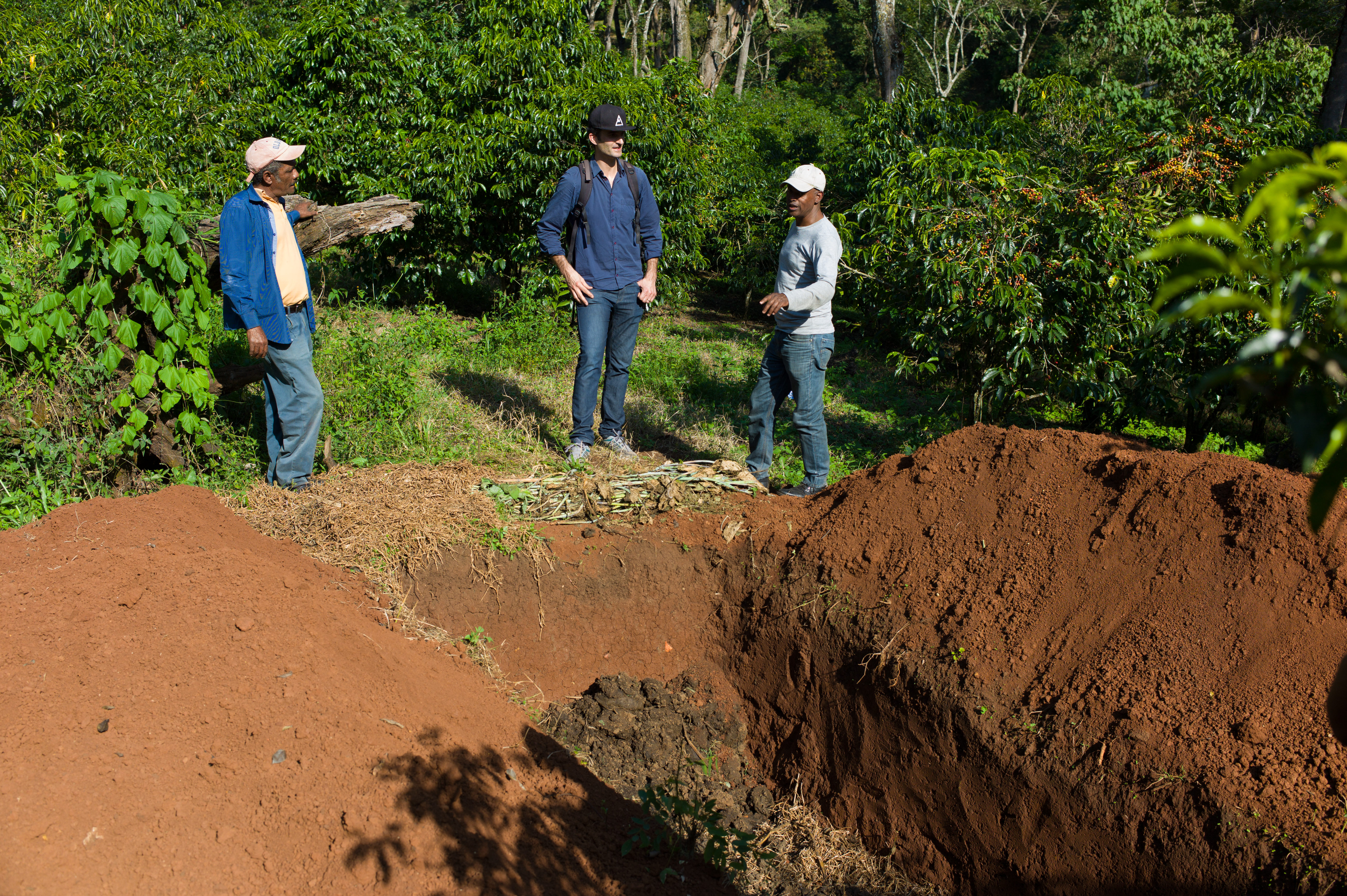 Peter discussing compost with Akmel and Befekadu