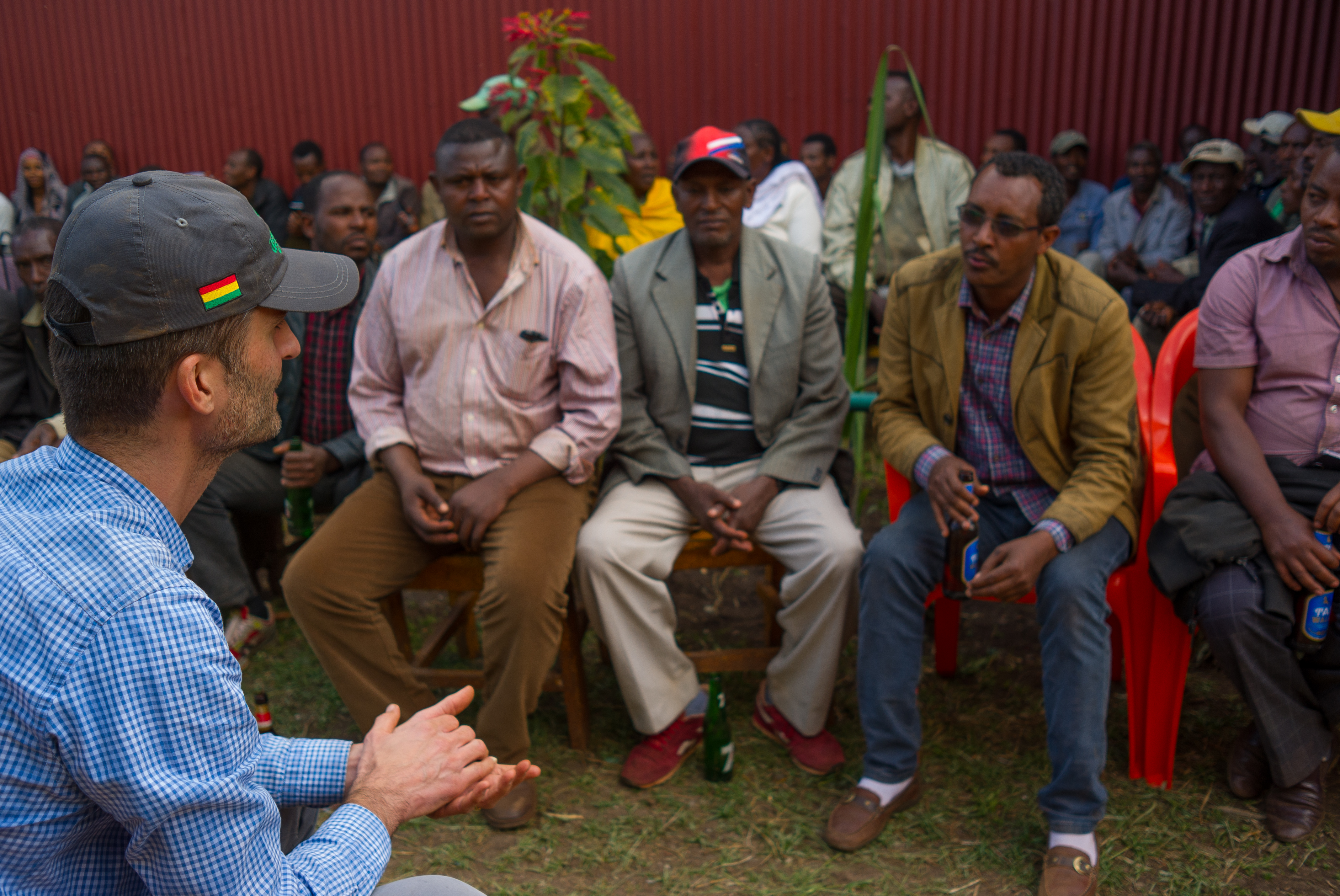 Peter speaking with the farmers