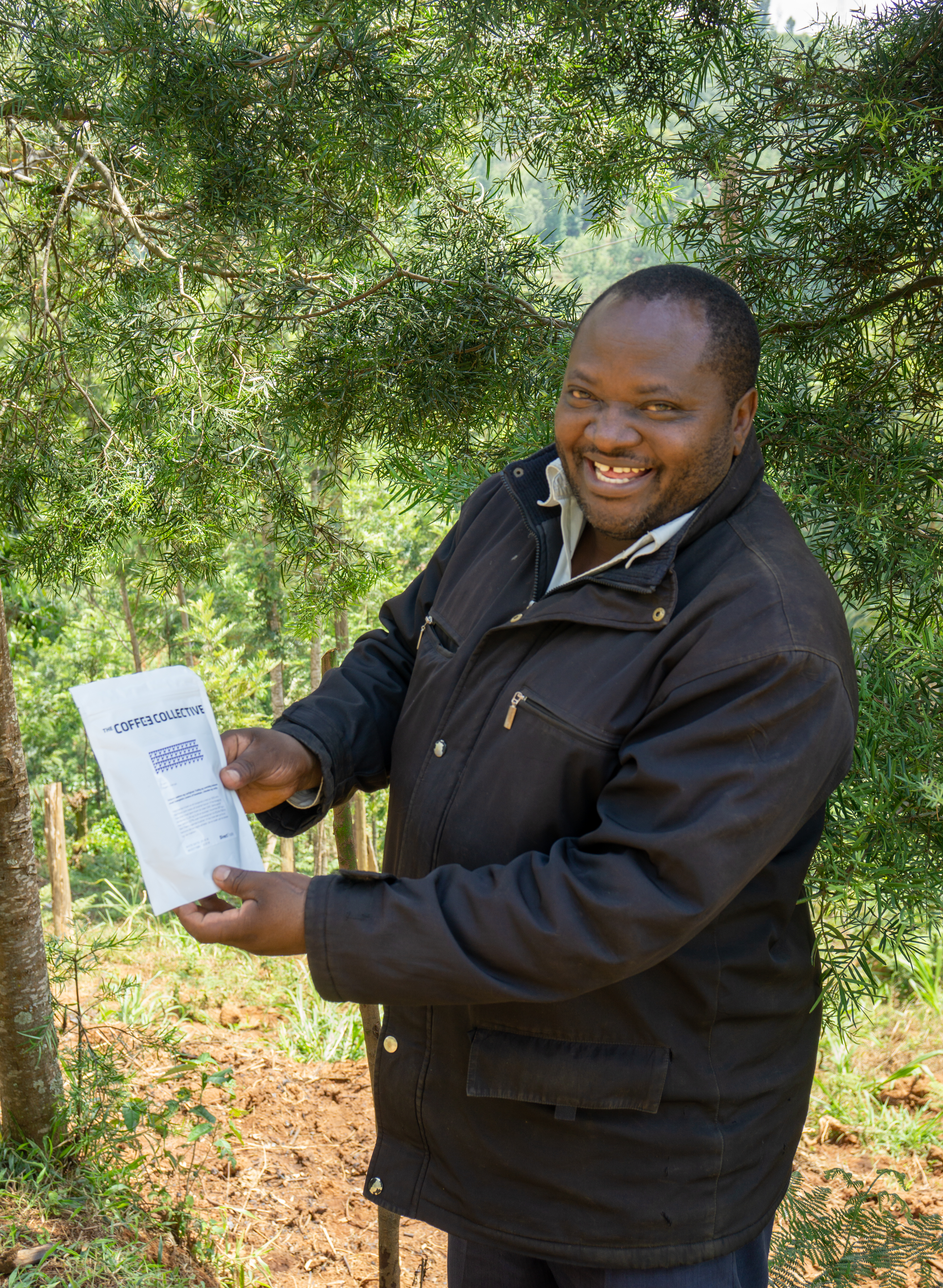 Kieni farmer Paul Mugo Waithaka is very happy to get a bag of his own coffee