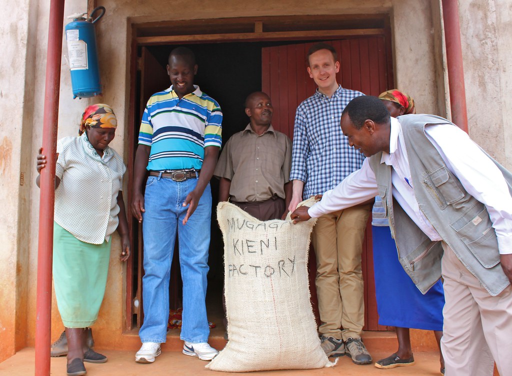 Klaus together with Kieni farmers, board chairman Charles Musai Ihatu, Factory Manager Geofrey Wanjau and CMS's Phillip Kamau