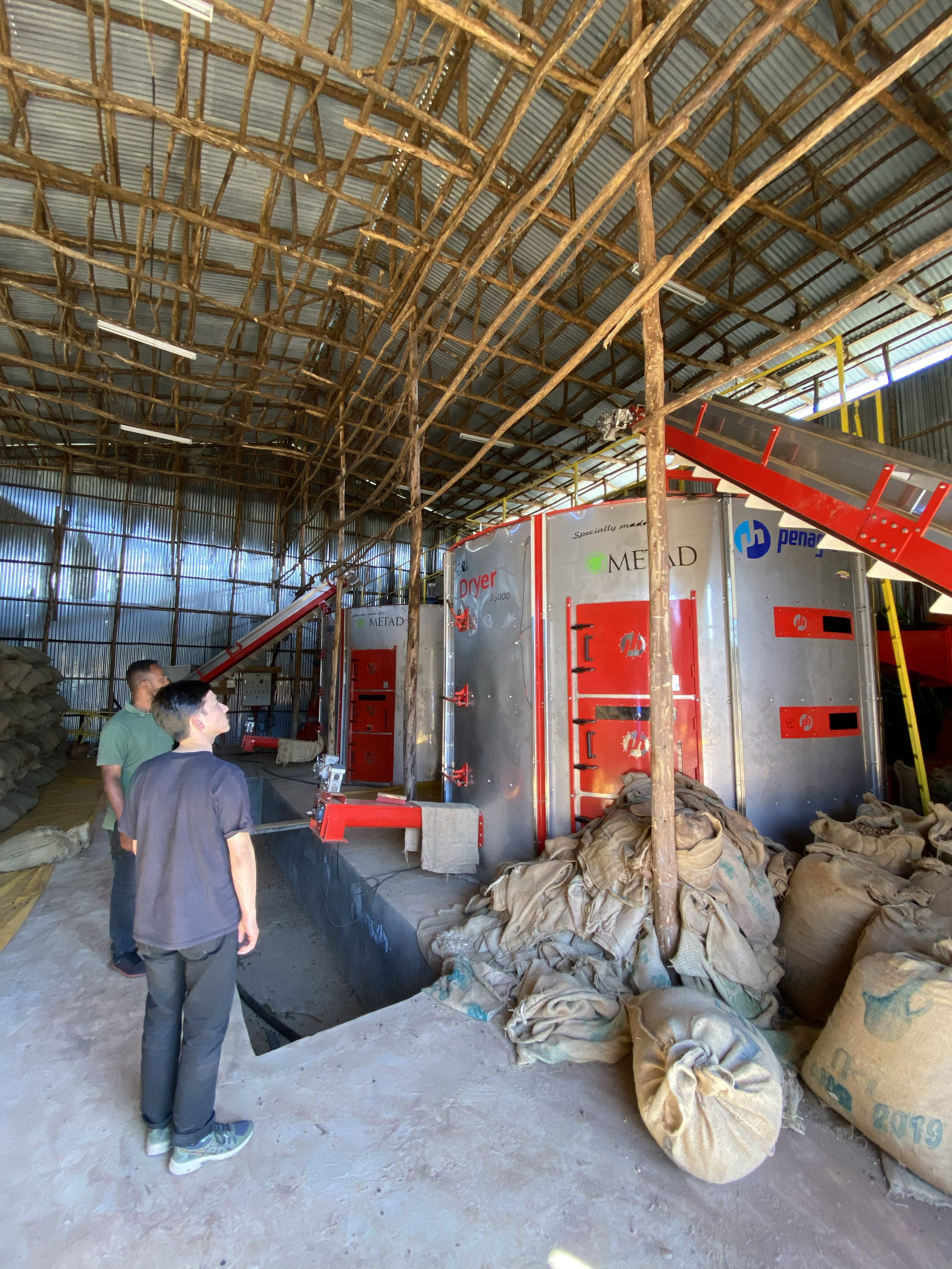 Delnessaw and George at the dry mill