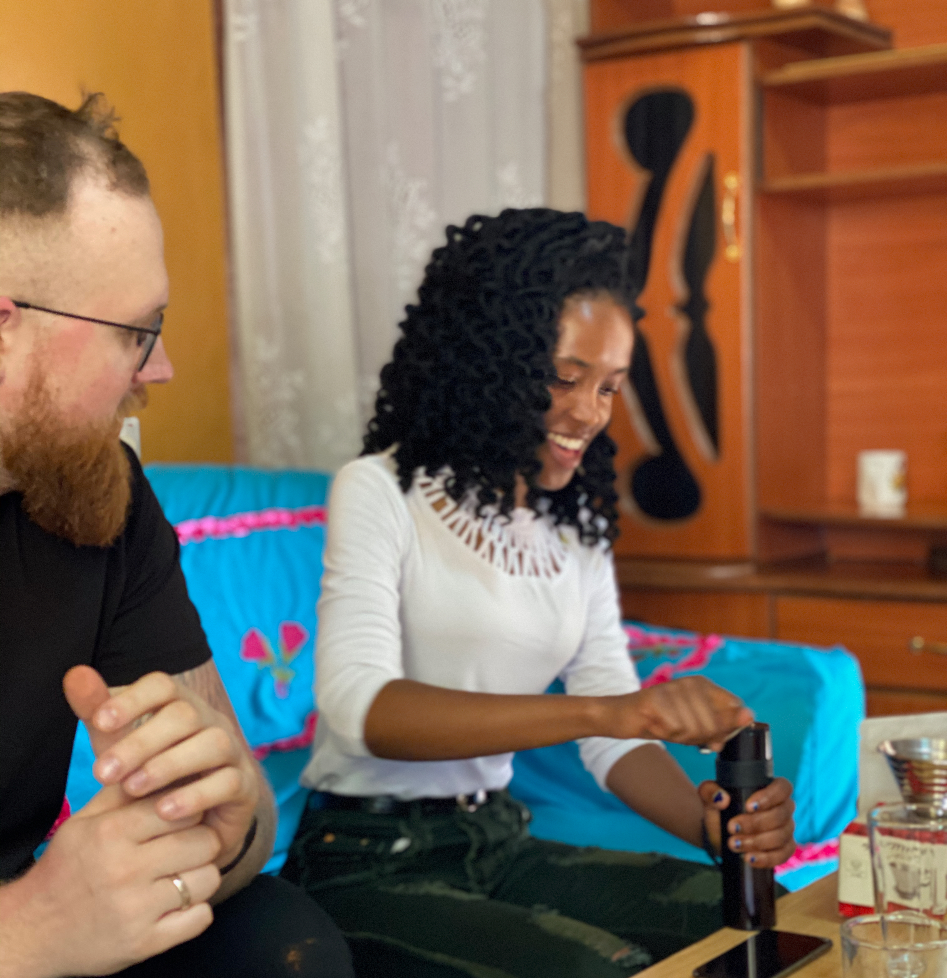 Bar manager Janis, showing Veronica how he brews coffee