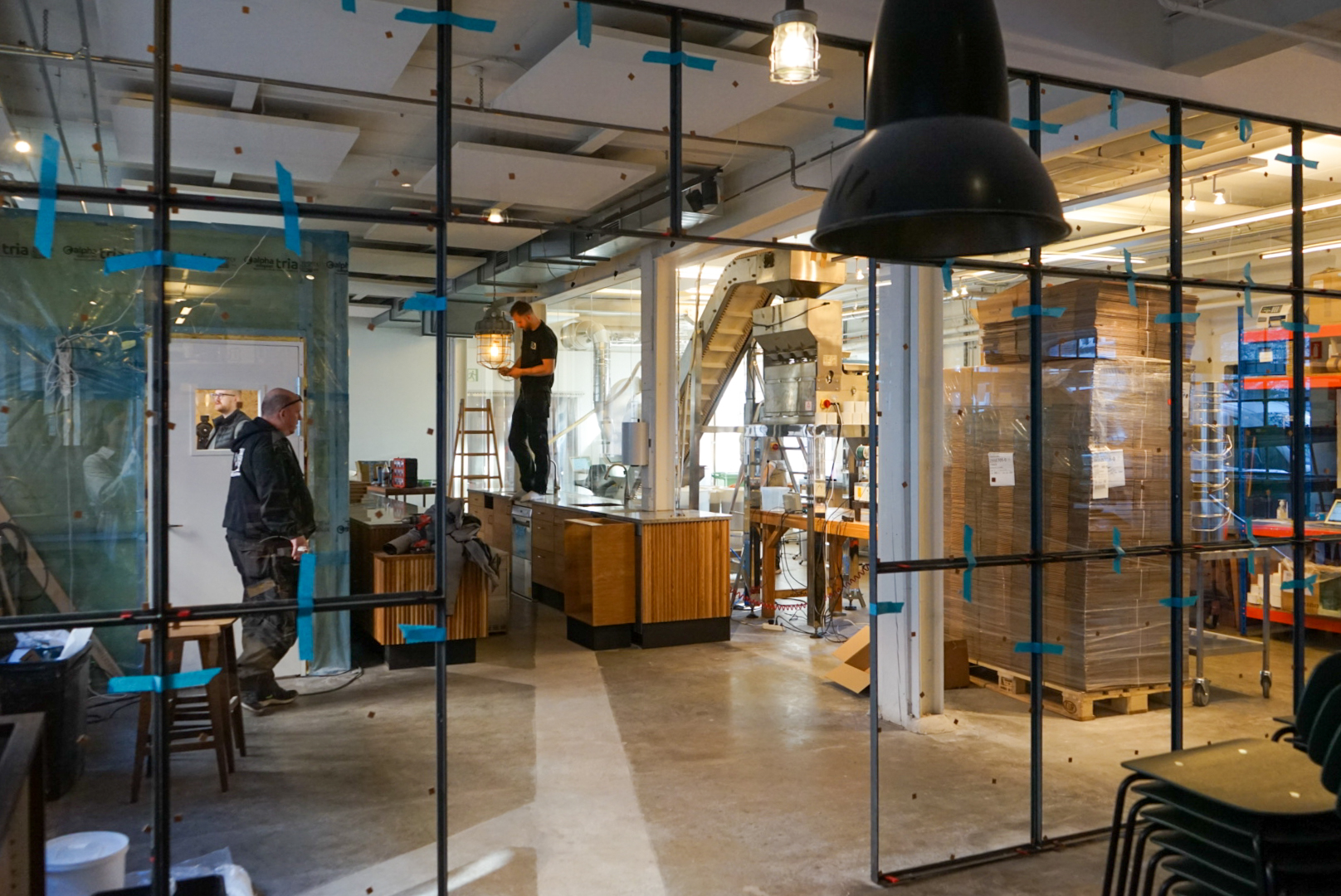 With glass walls, the space appears open and gives a look into the production