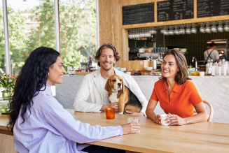 Cryptonow customers having a conversation about cryptocurrencies at a café