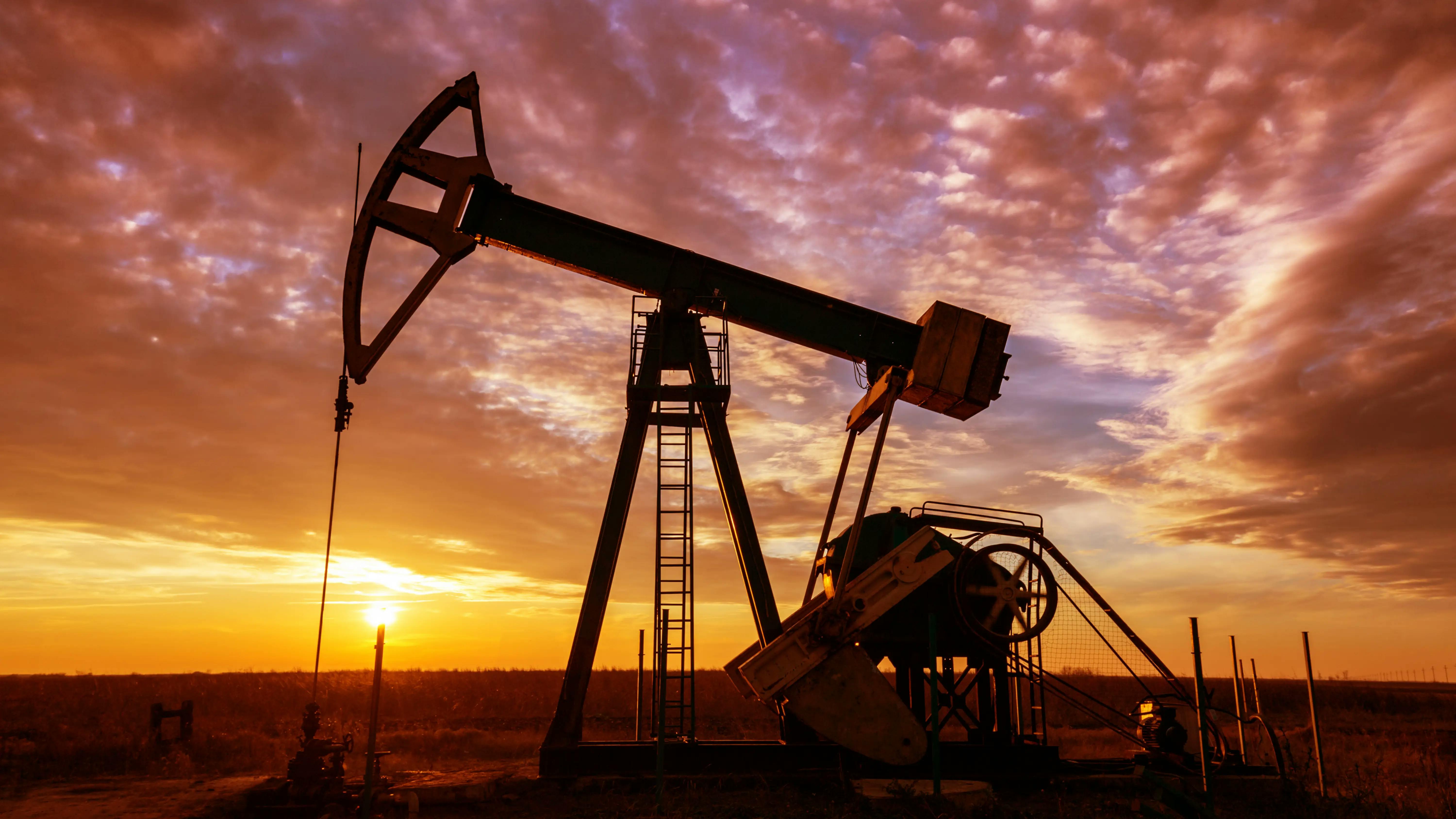 An oil rig at sunset.
