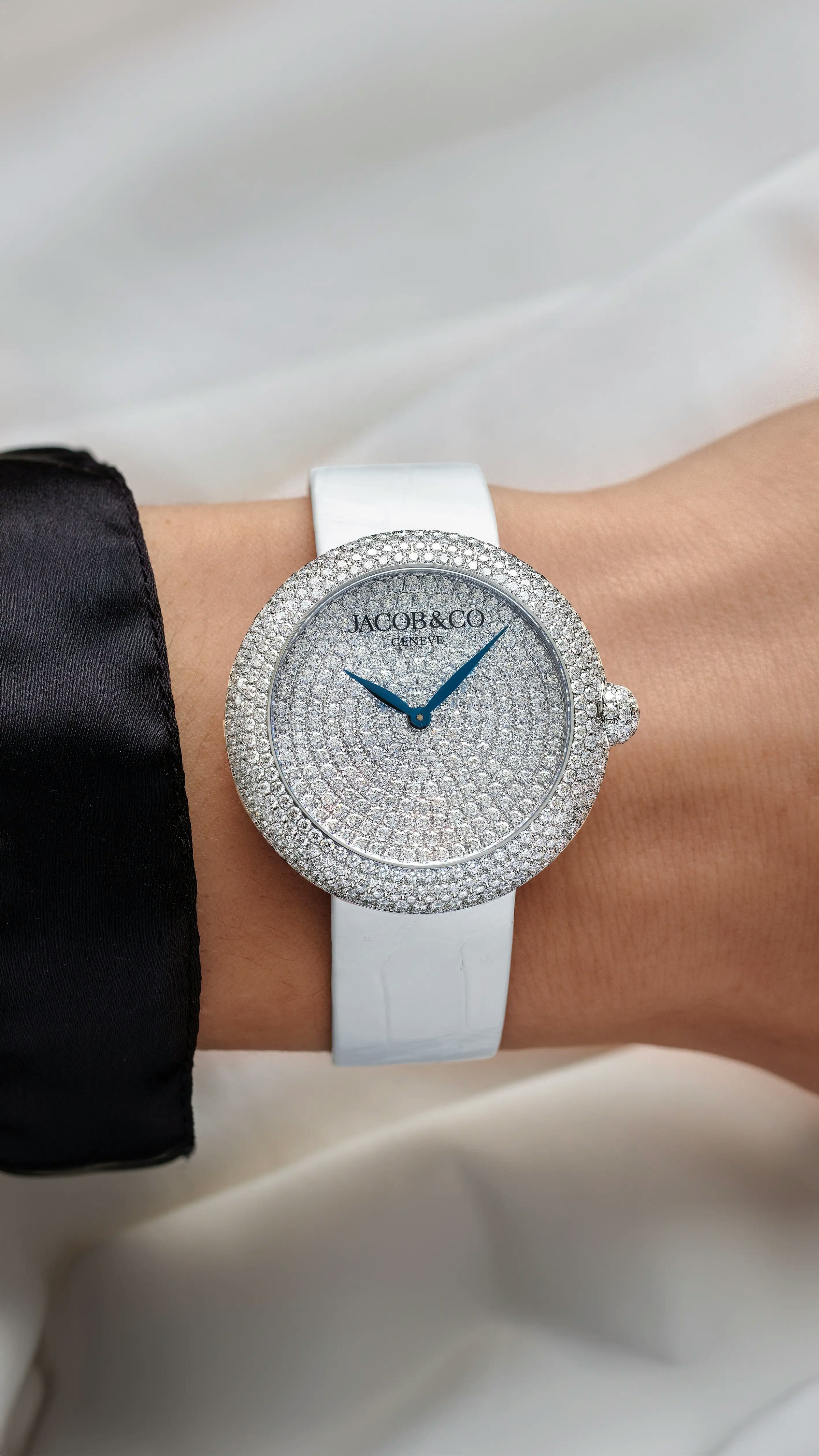 The white gold Brilliant Pavé watch, worn on the left wrist.